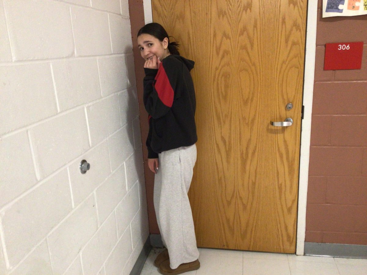 Delaney poses for a picture in the WMS hall ways. 