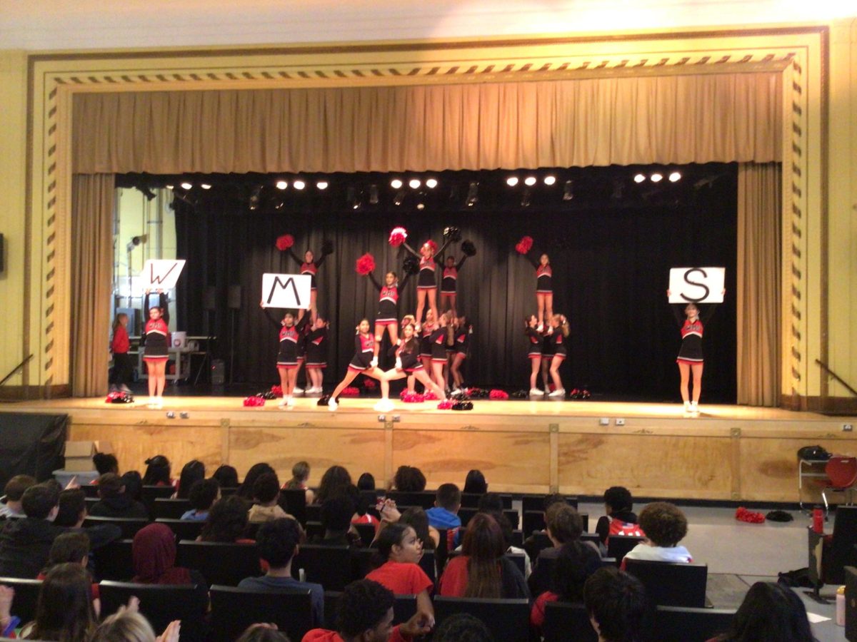 Cheerleaders perform at the winter recognition assembly at WMS.