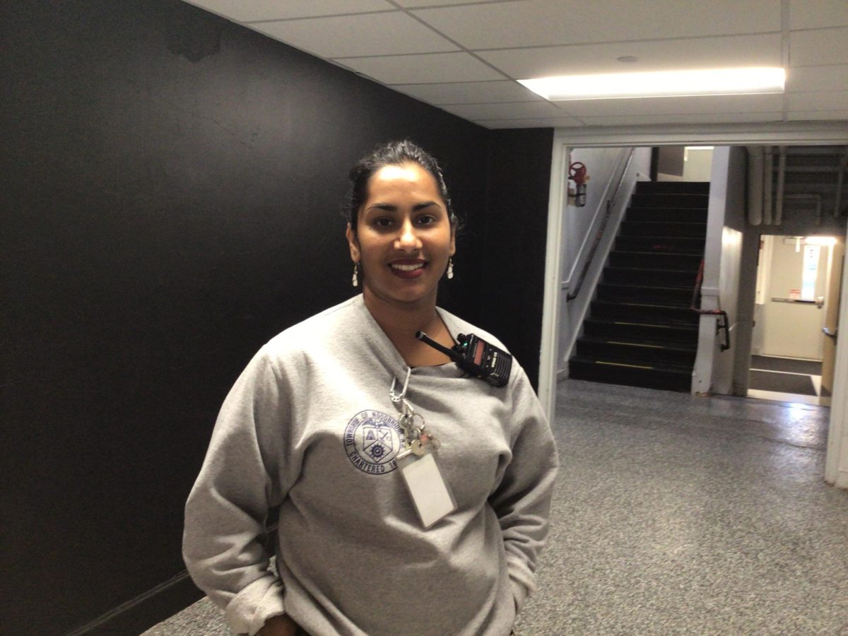 Ms. Lalita poses for a photo outside of the cafeteria at WMS.