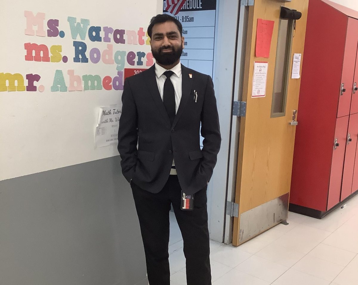 Mr.Ahmed poses for a picture at  Woodbridge middle school.