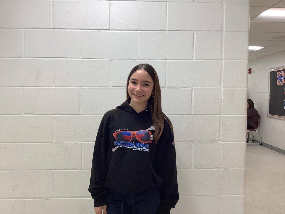 Teala Caverly, a 7th grade student on the WMS cheer team, poses for a picture at WMS. 
