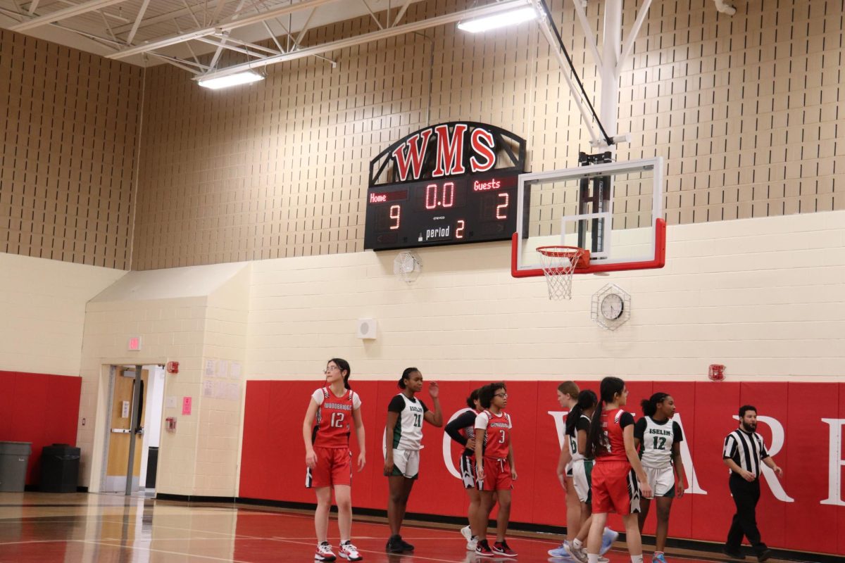 The WMS girls' basketball team plays the Islen girls' basketball team.