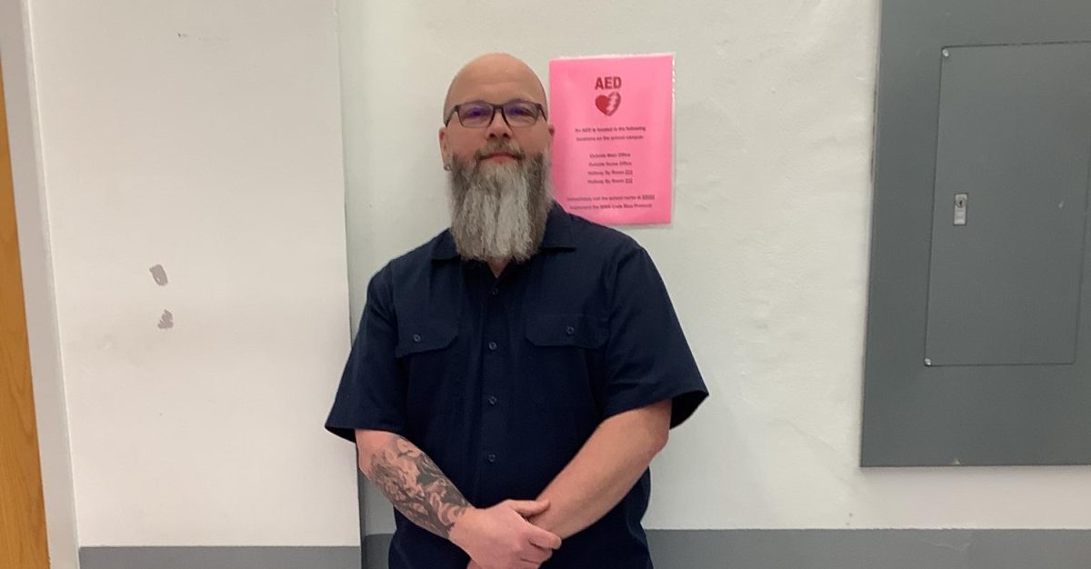Mr.Miller poses for a picture outside of his room in WMS