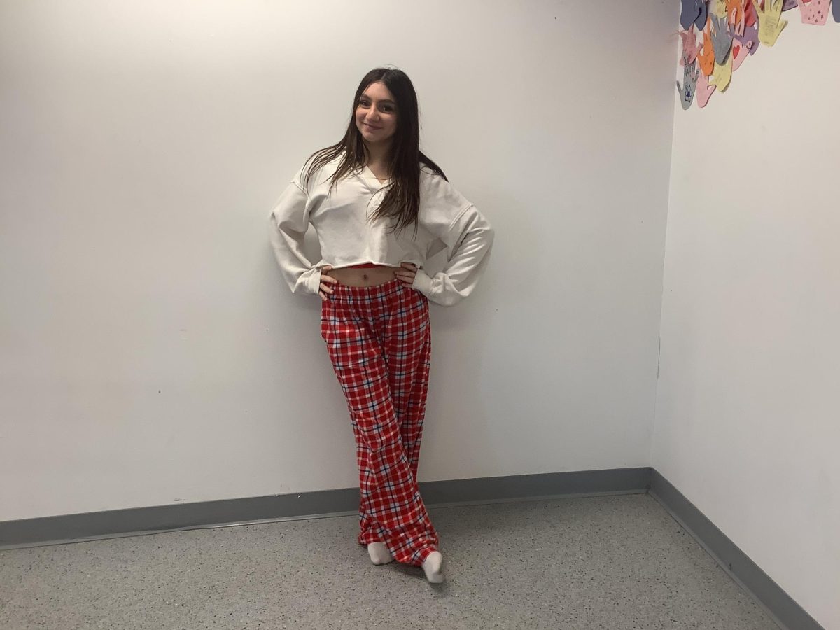 Emma Ventura poses for a picture on Pajama Day in WMS hallway.