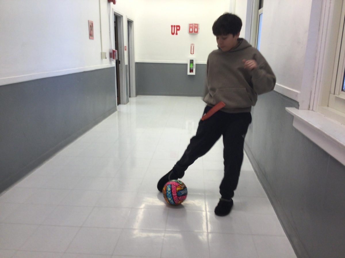 Nathan Almeira,a 7th grader, kicks a soccer ball at WMS