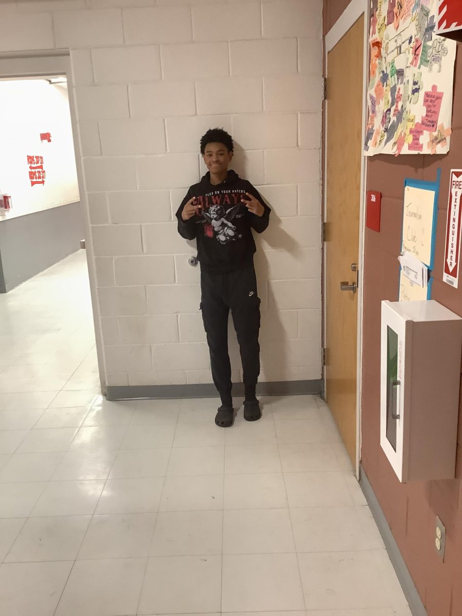 Jaden poses for a picture on the wall