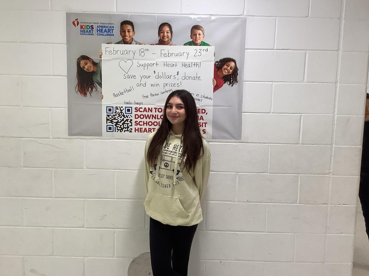 Emma Ventura stands outside of the gym at WMS