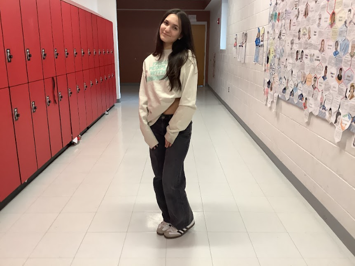 Delaney Fallon poses for photo in WMS hallway.