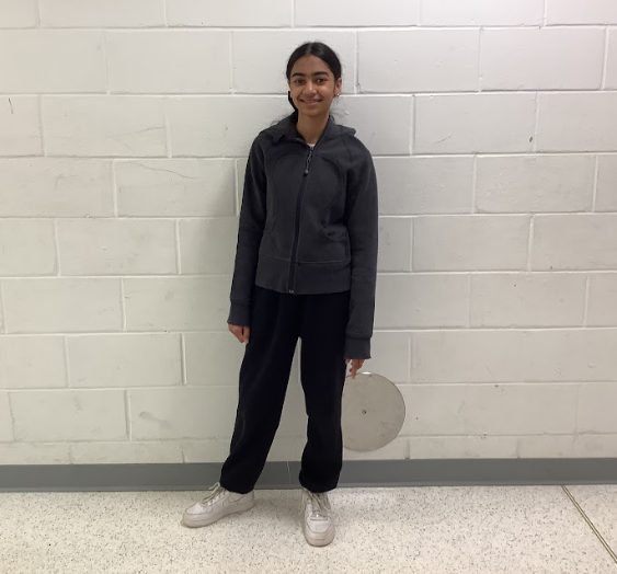 Meher Bhela poses for a photo in WMS hallway.