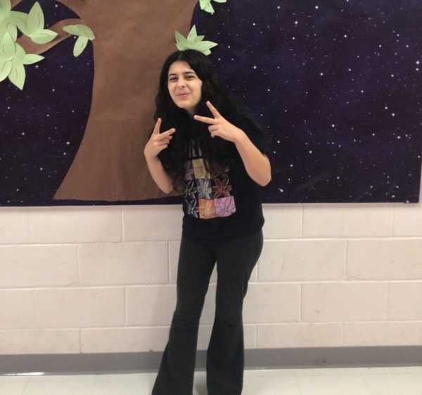 Gianna De Pinto poses into front of the board